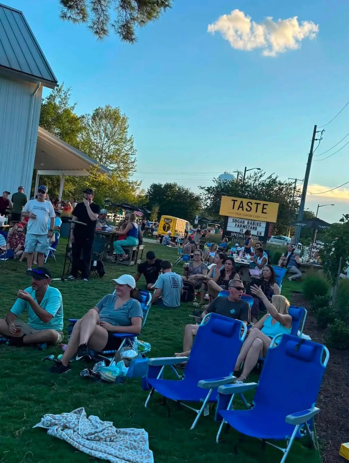 Crowd relaxing on the lawn at a Bright Roads Band outdoor show